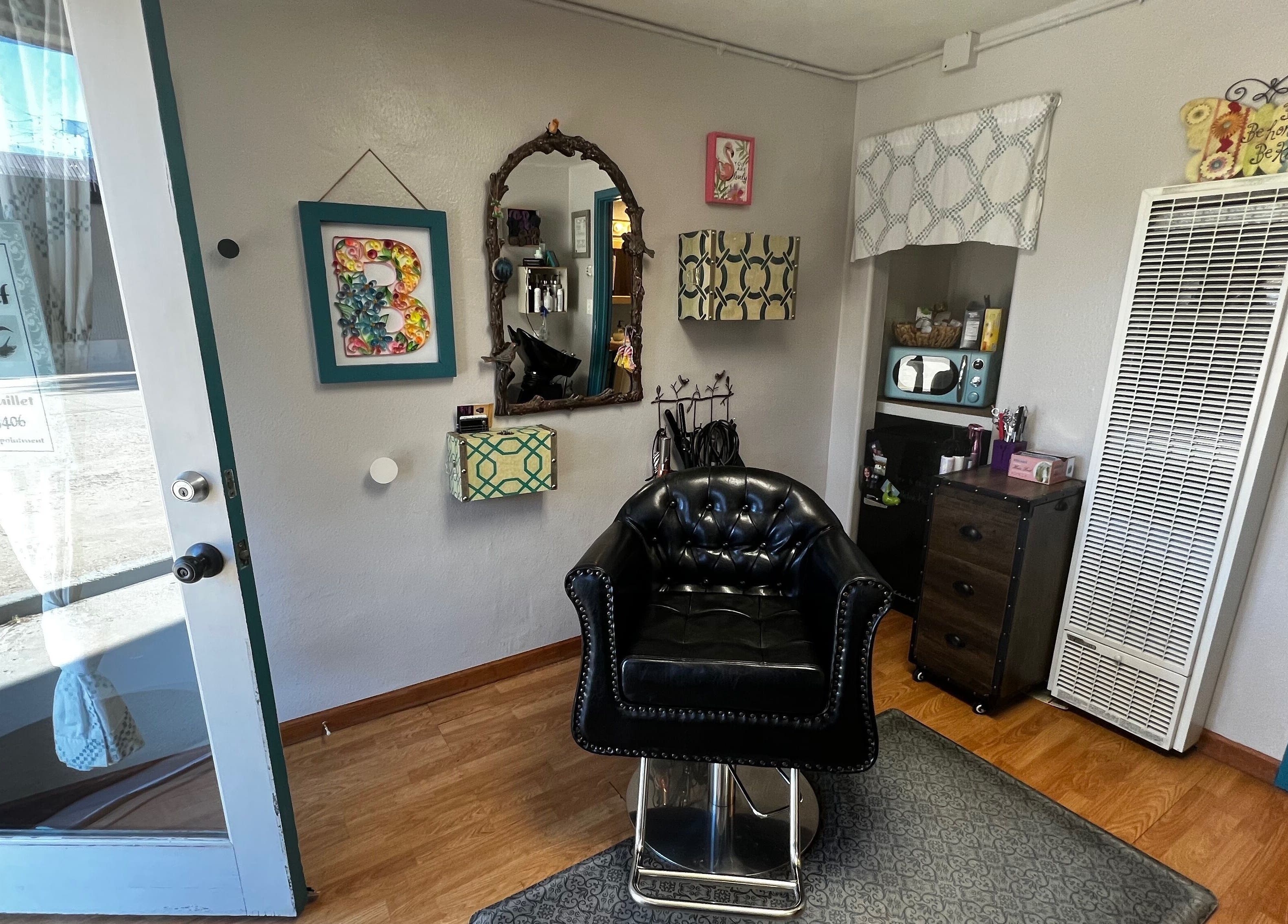 Shear Mischief salon's chic interior with leather chair in Durango, Colorado, US.