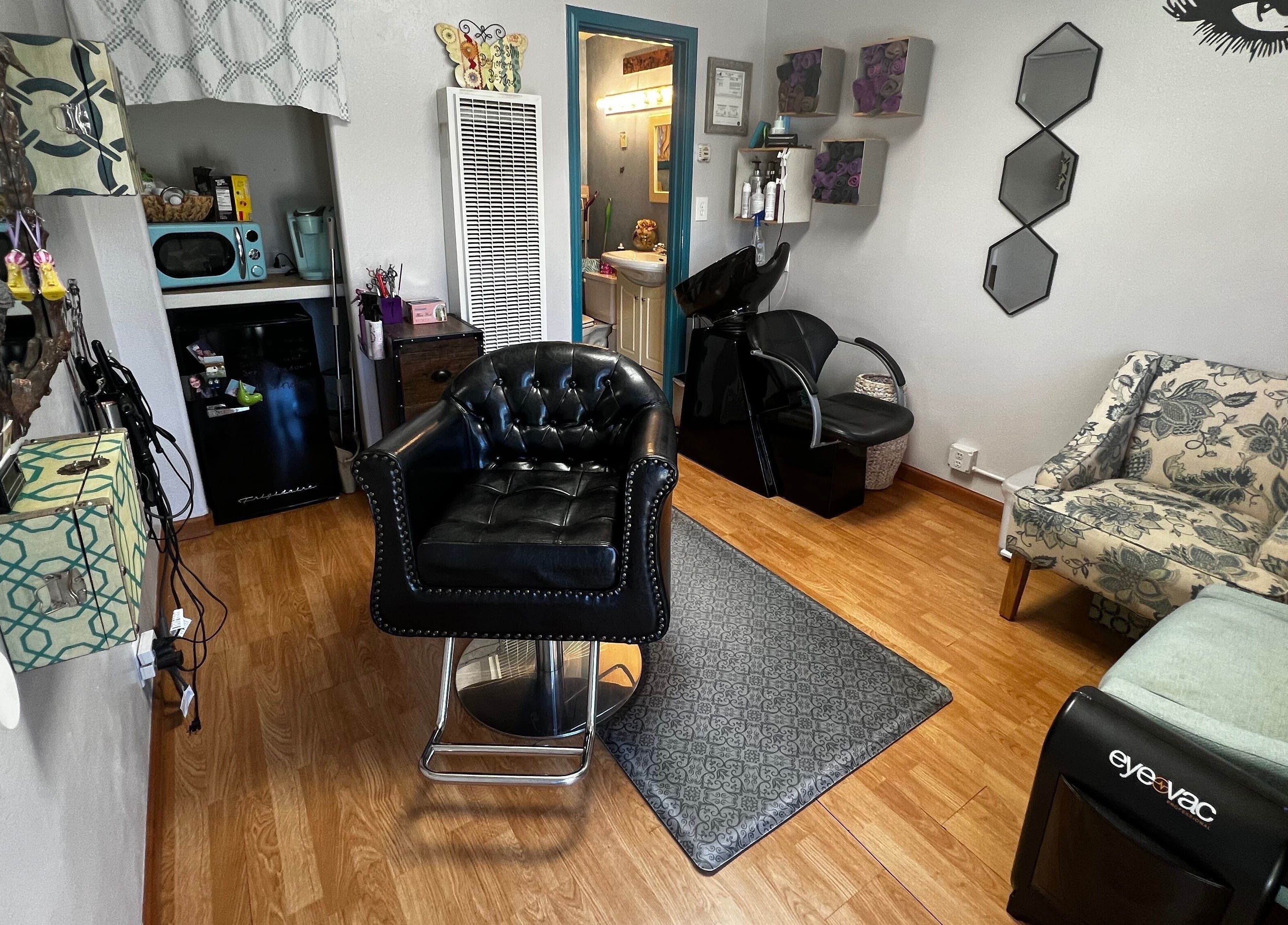 Chic salon interior at Shear Mischief in Durango, Colorado, US, featuring stylish chairs and decor.
