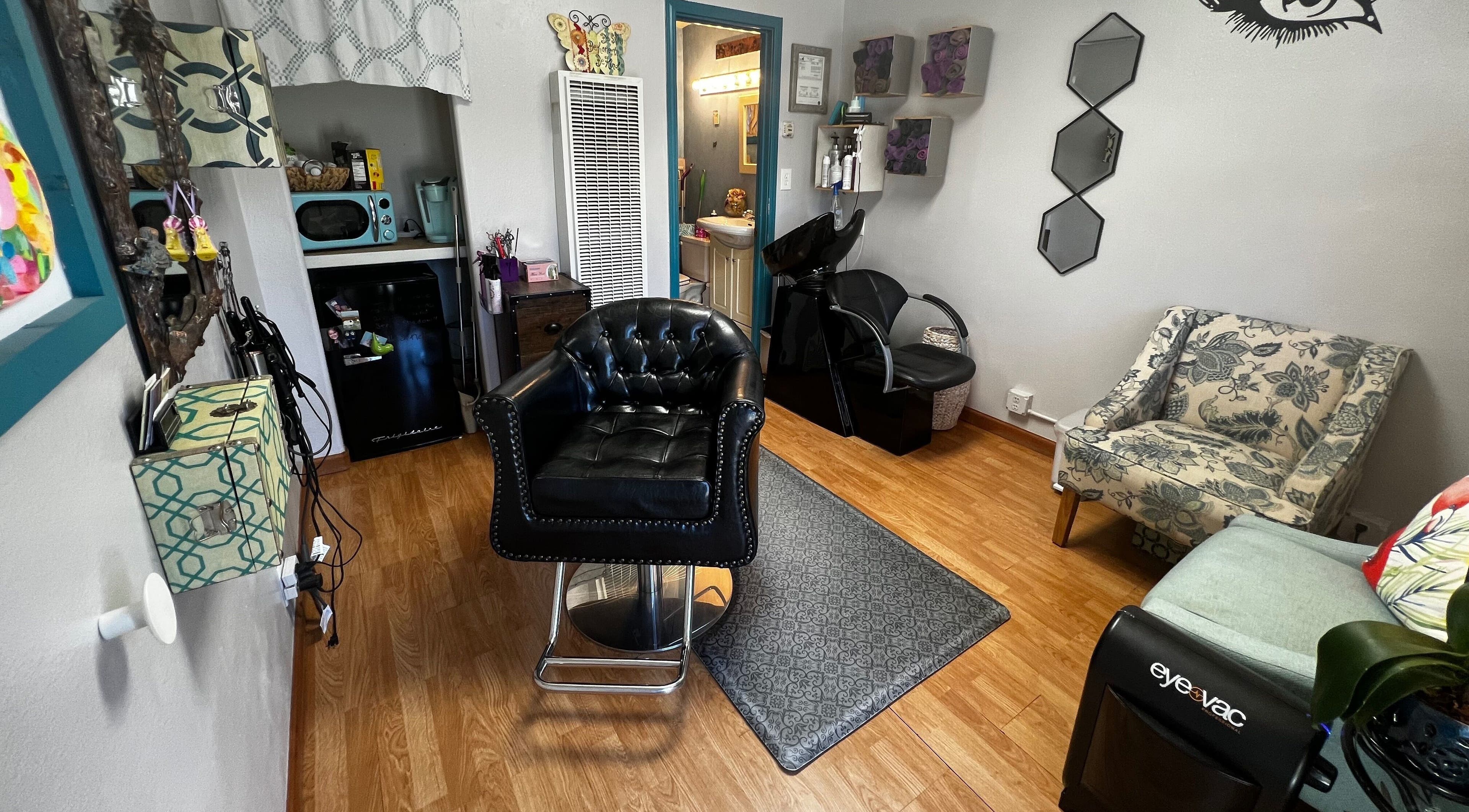 Chic salon interior at Shear Mischief in Durango, Colorado, US, featuring stylish chairs and decor.