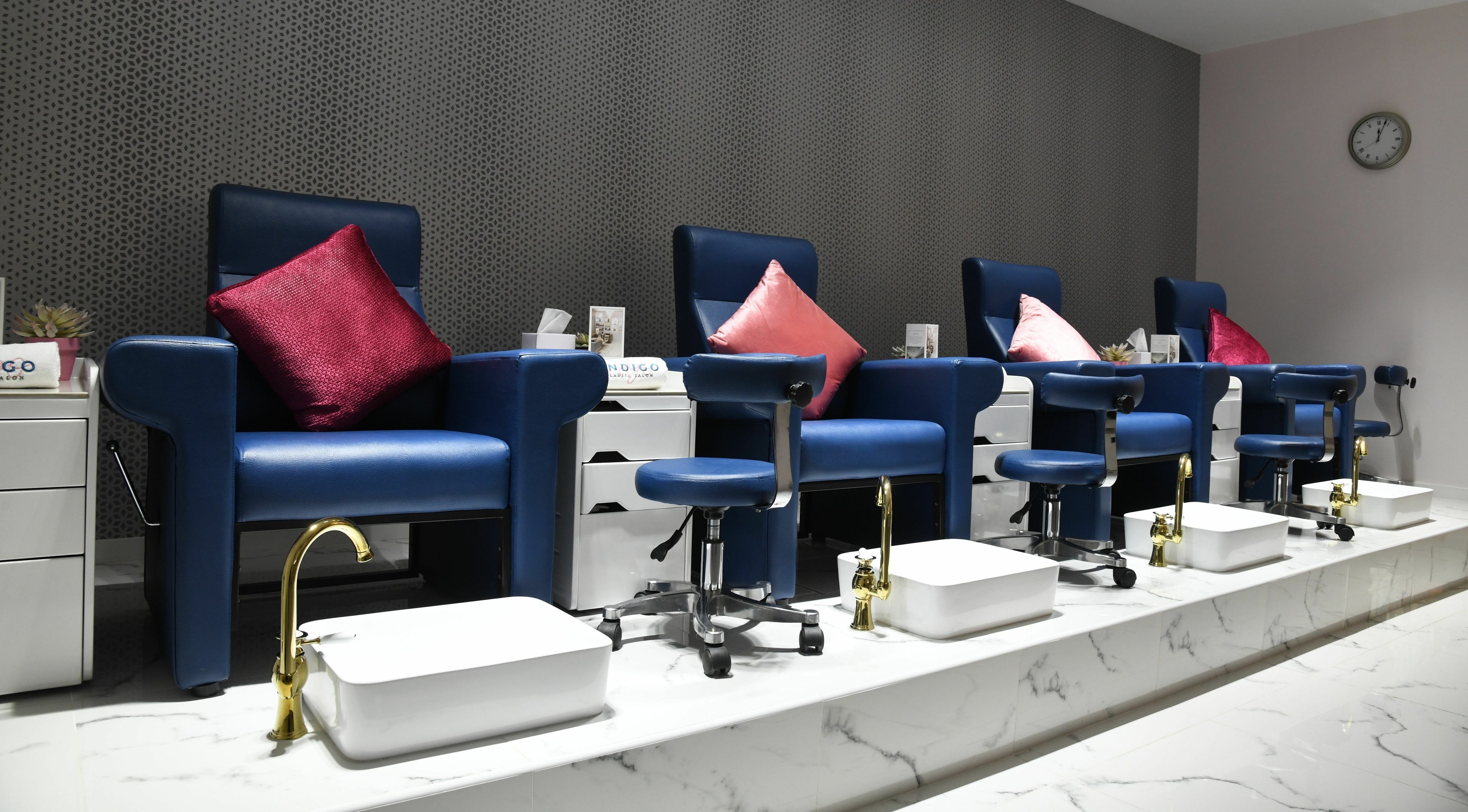 Elegant pedicure chairs at Indigo Ladies Salon in Abu Dhabi, AE, featuring modern design and comfort.