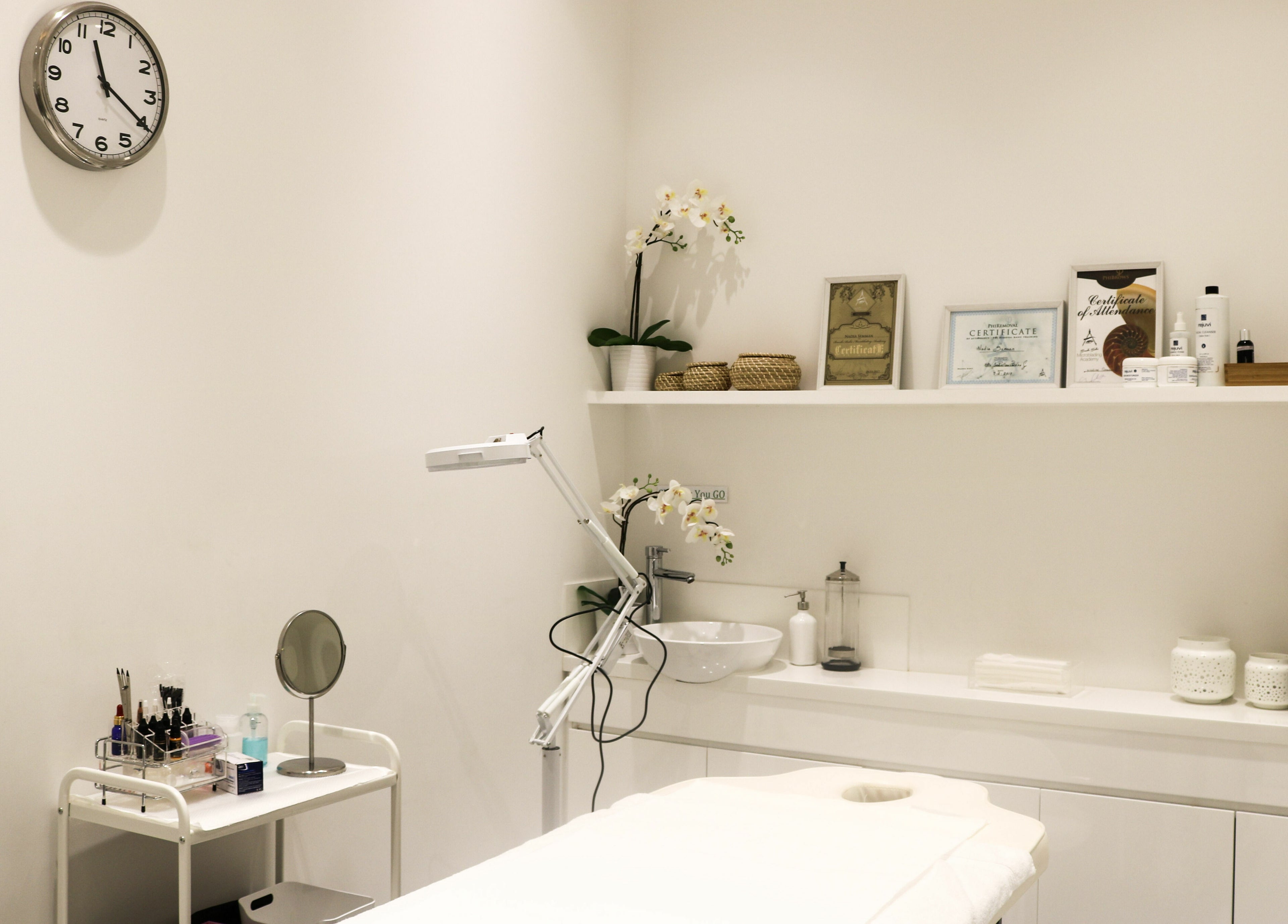 Serene treatment room at Dial A Nail - Palm in Dubai, Dubai, AE, featuring elegant decor and wellness tools.