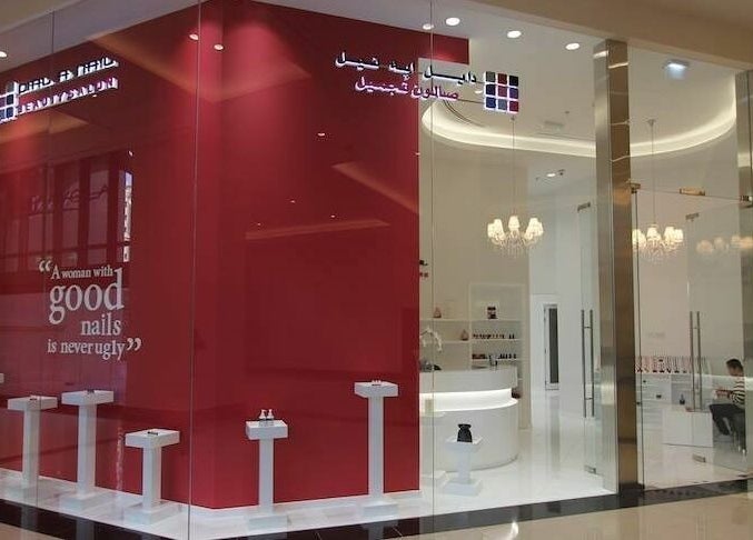 Elegant storefront of Dial A Nail - Palm in Dubai, Dubai, AE showcasing a modern nail salon design.