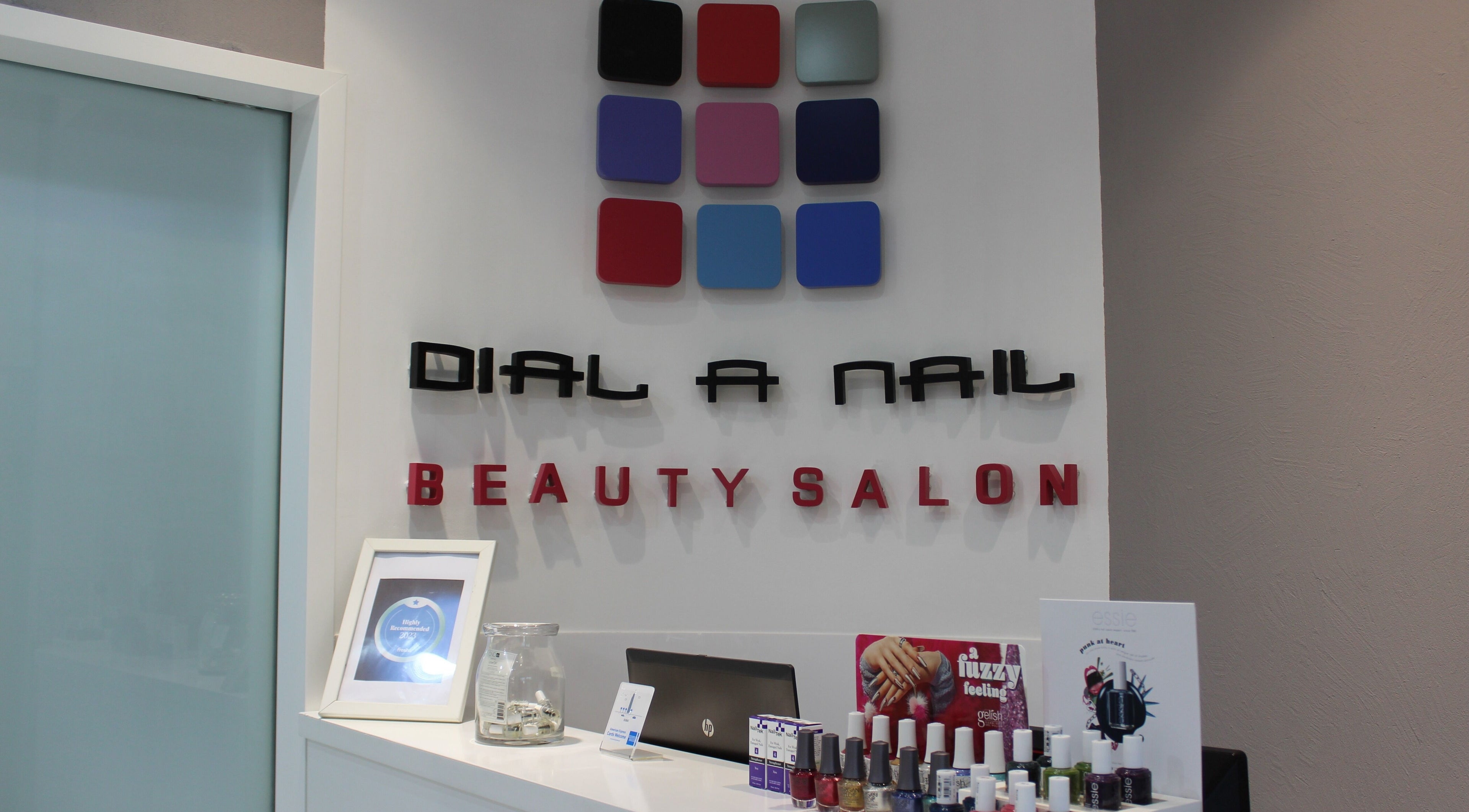 Modern reception at Dial A Nail - Downtown | Hair Services, Dubai. Stylish decor with nail products displayed.