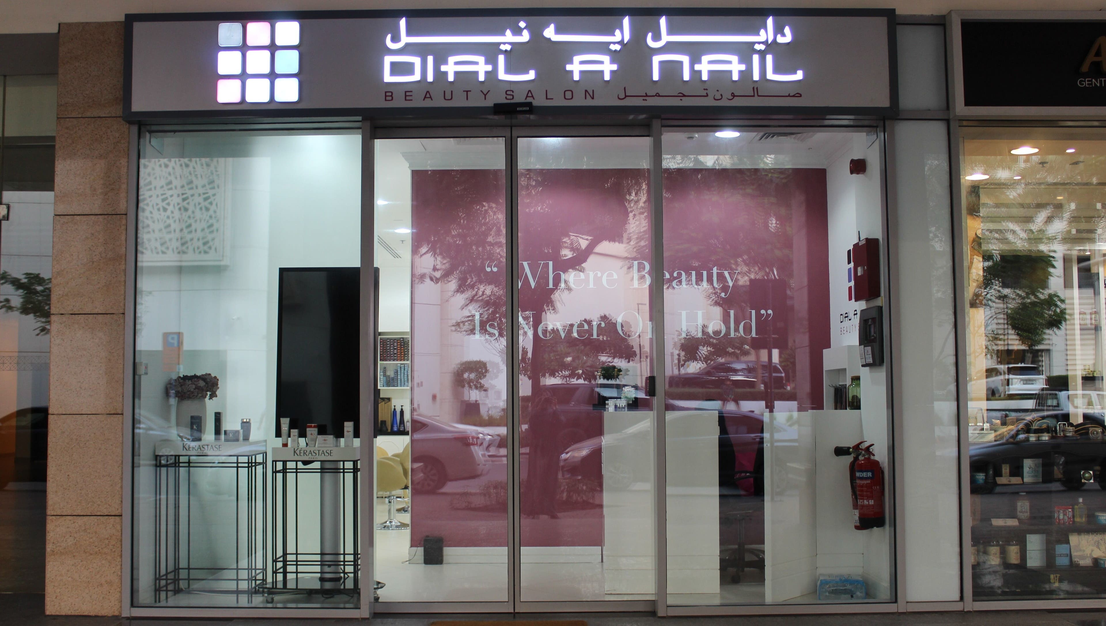 Exterior view of Dial A Nail - Boulevard in Dubai, AE, featuring stylish signage and welcoming pink decor.