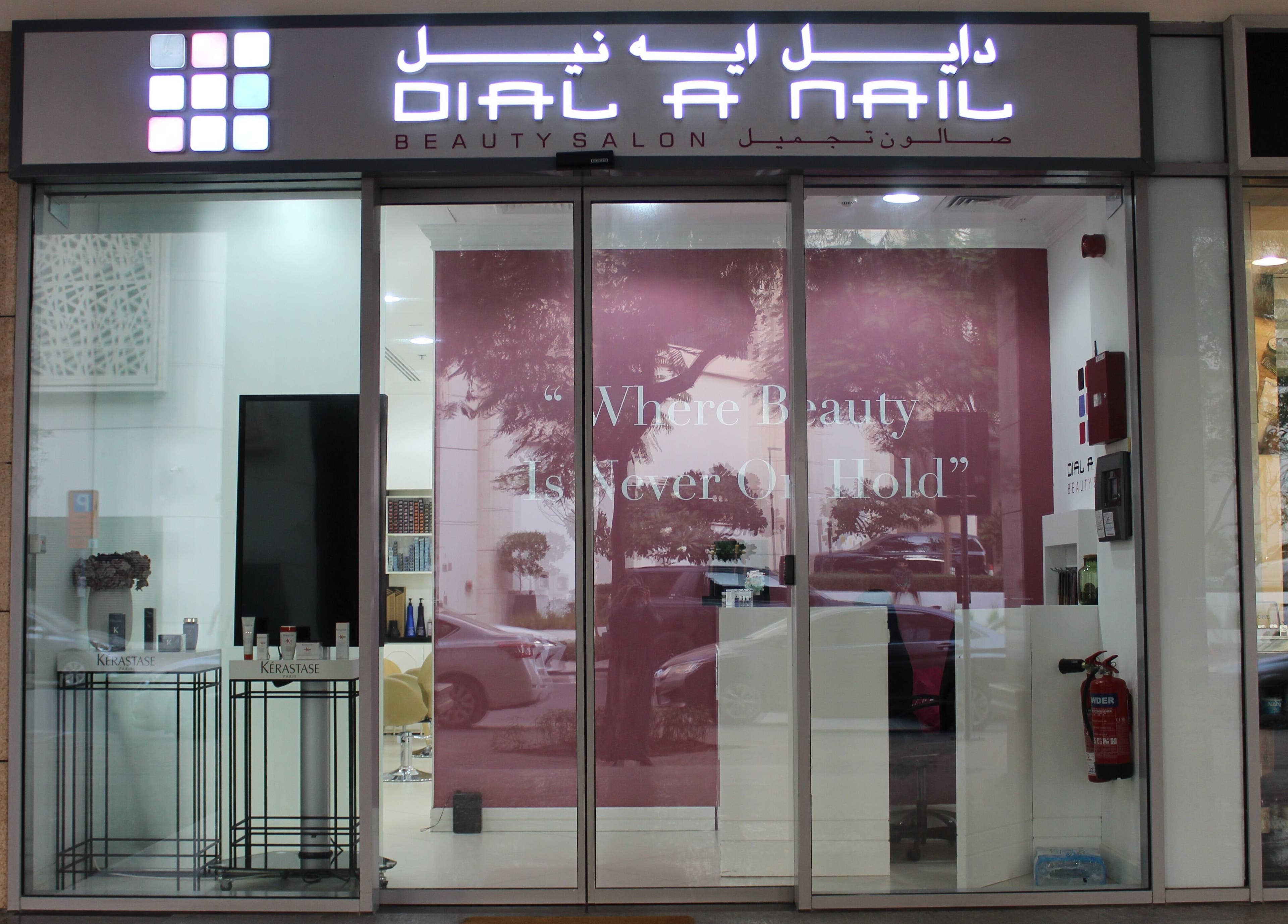 Exterior view of Dial A Nail - Boulevard in Dubai, AE, featuring stylish signage and welcoming pink decor.