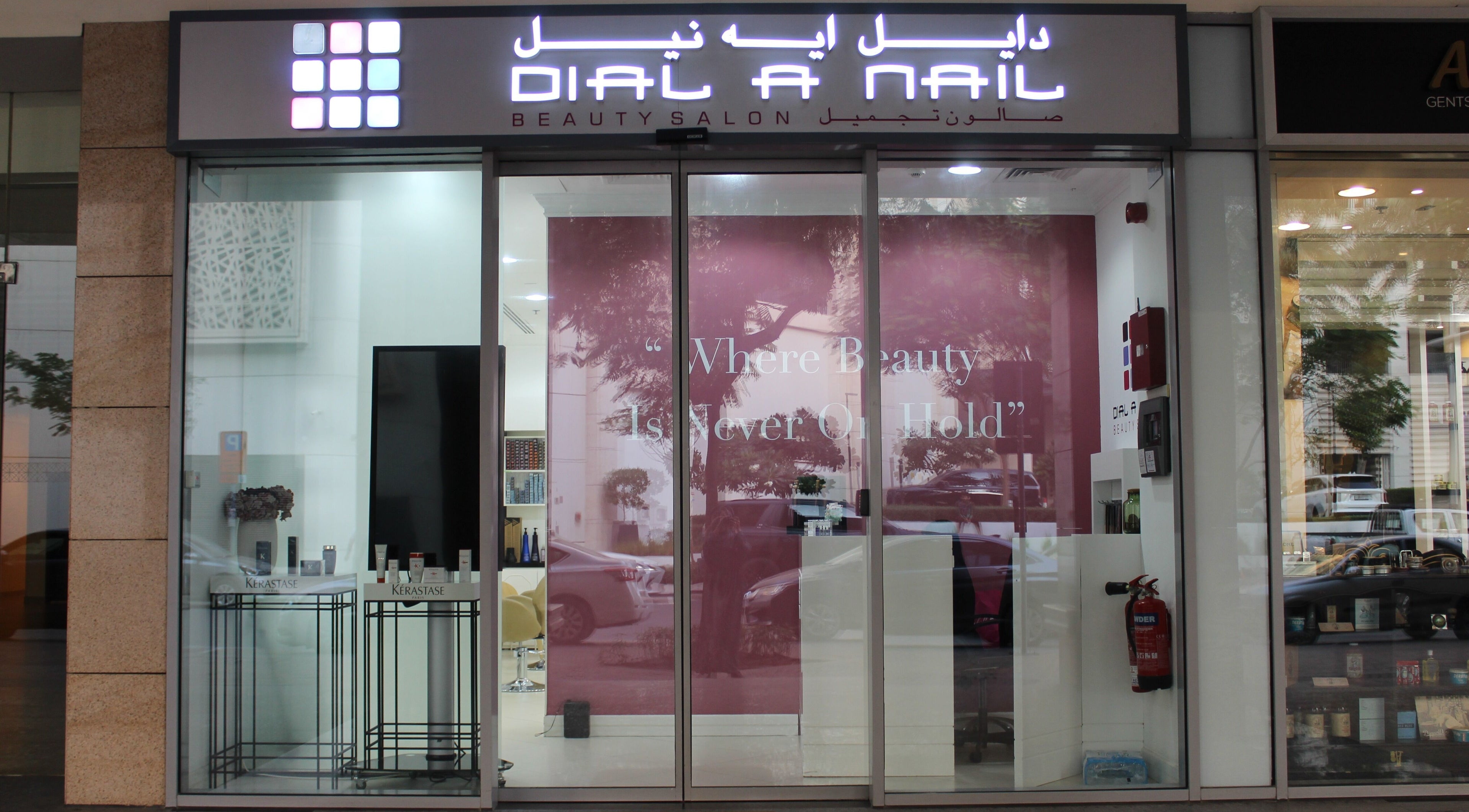 Exterior view of Dial A Nail - Boulevard in Dubai, AE, featuring stylish signage and welcoming pink decor.