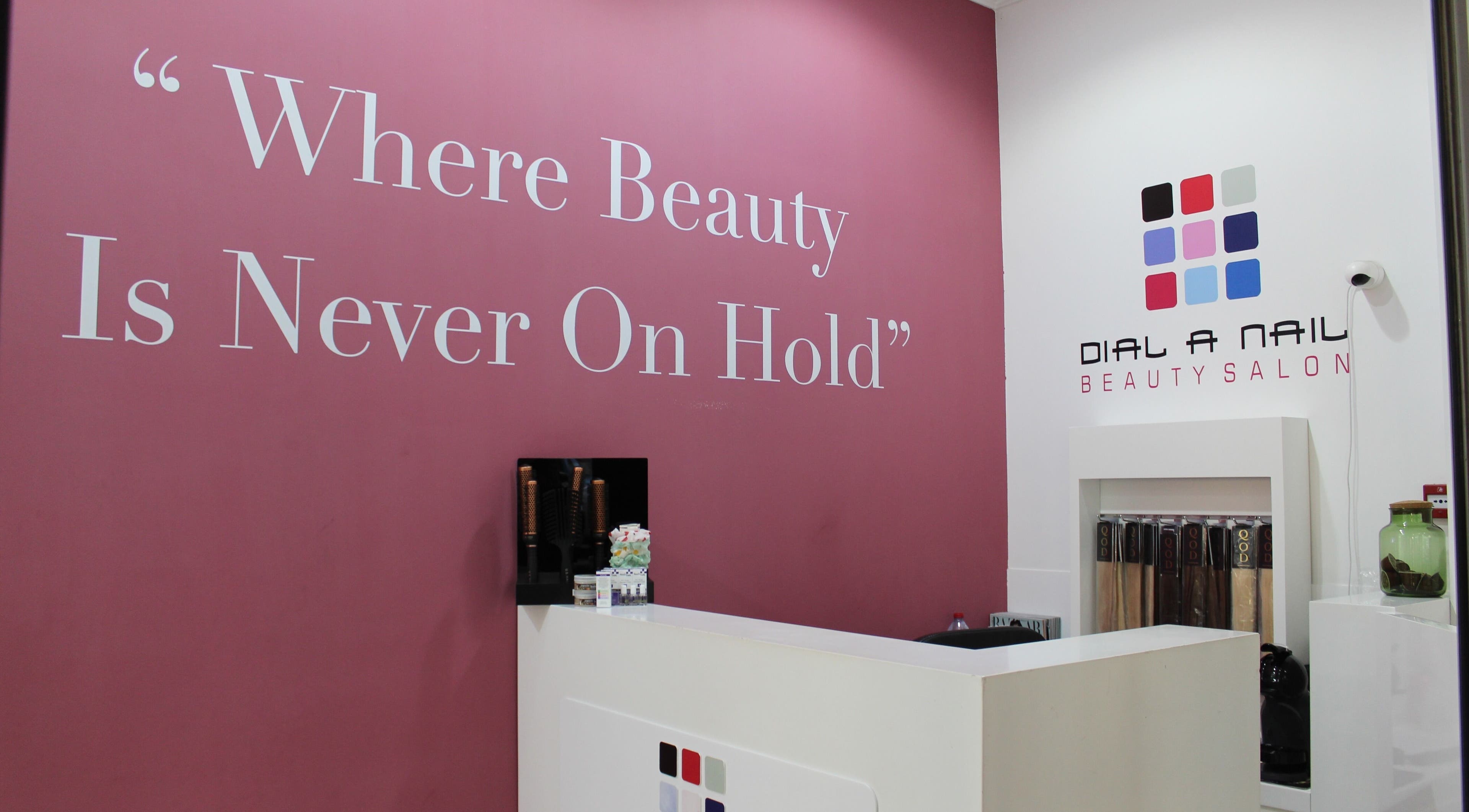 Reception area at Dial A Nail - Boulevard, Dubai, AE with slogan 'Where Beauty Is Never On Hold'.