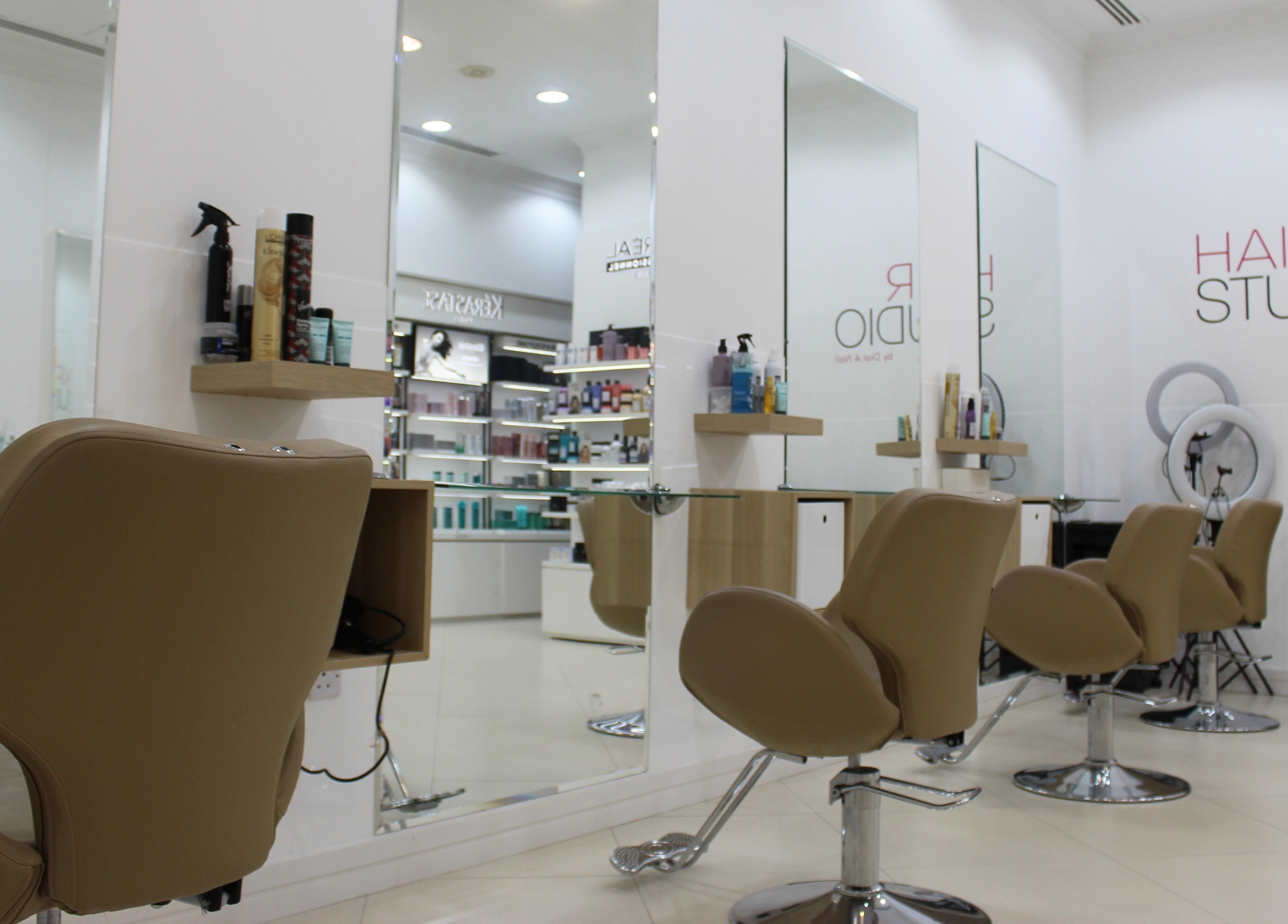 Elegant interior of Dial A Nail - Boulevard salon in Dubai, AE showcasing styling chairs and beauty products.
