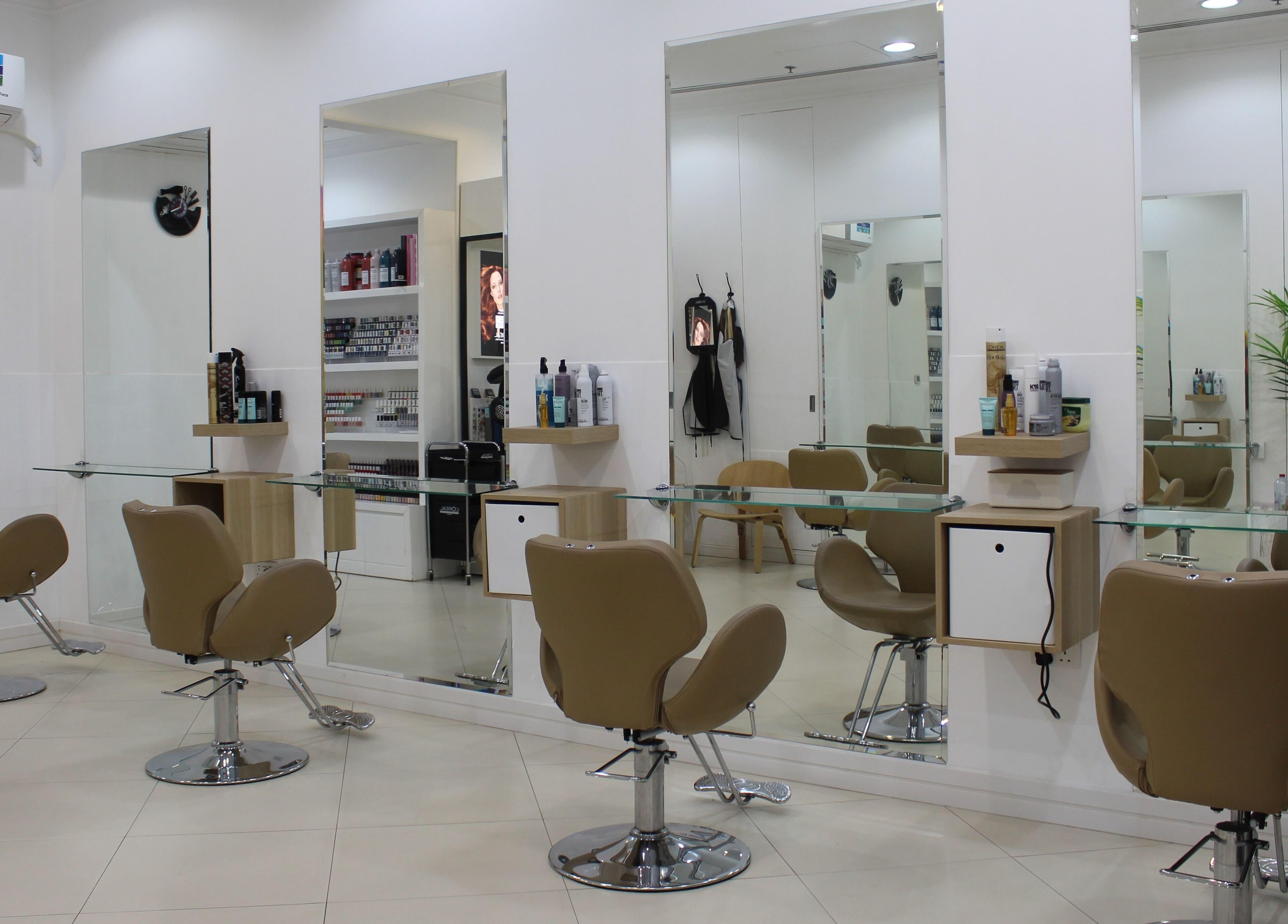 Elegant salon interior with plush chairs at Dial A Nail - Boulevard, Dubai, AE.
