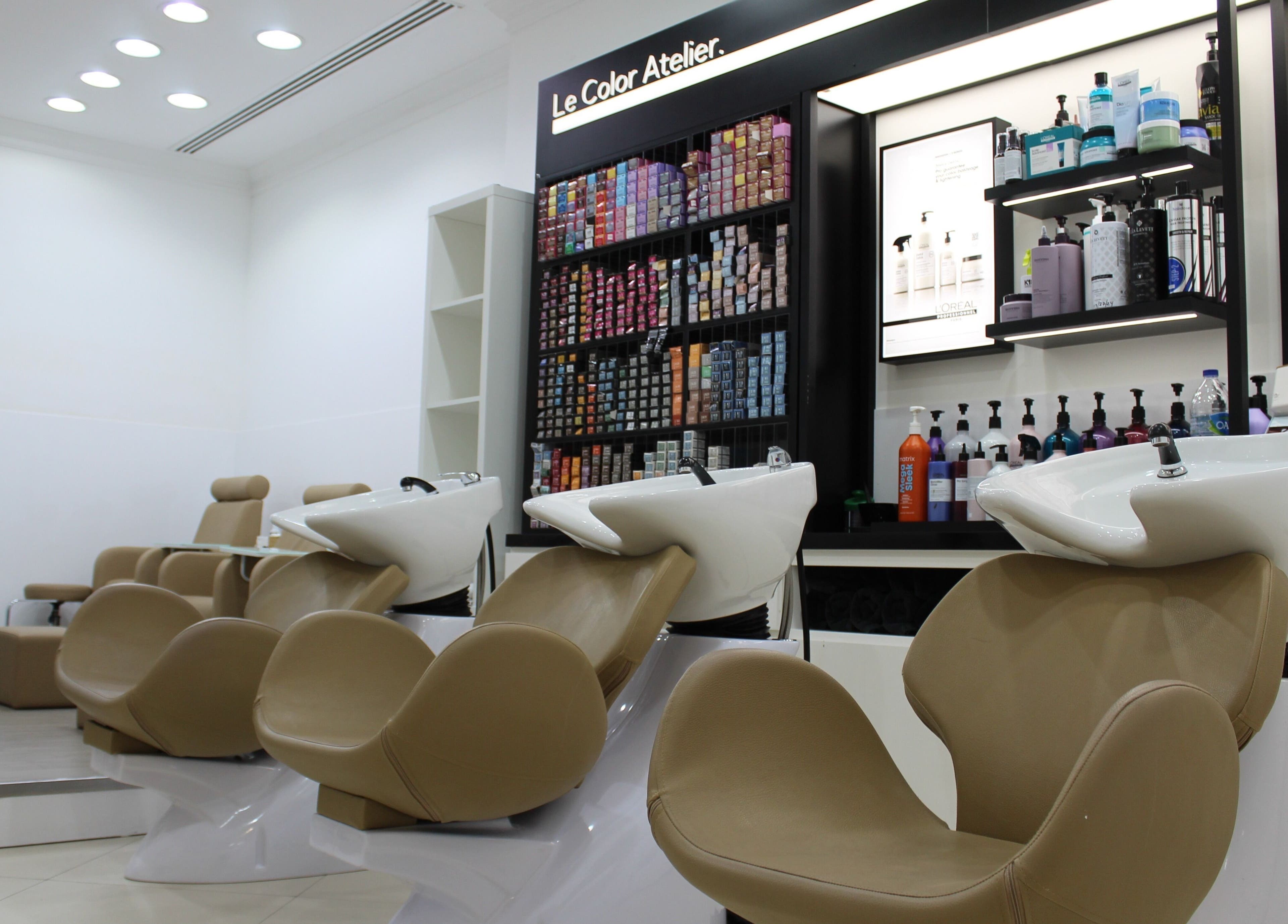Luxurious salon shampoo stations at Dial A Nail - Boulevard, Dubai, AE with stylish seating and product displays.