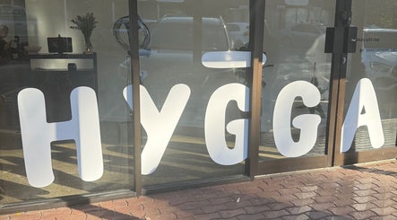 Front entrance of Hygga, showcasing large window signage at Mudgeeraba, Queensland, AU.