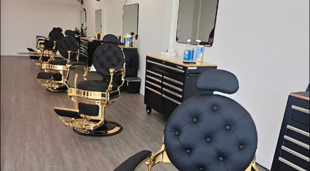 Luxurious black and gold barber chairs at Master Cuts, Oshawa, Ontario, CA, showcasing upscale grooming services.