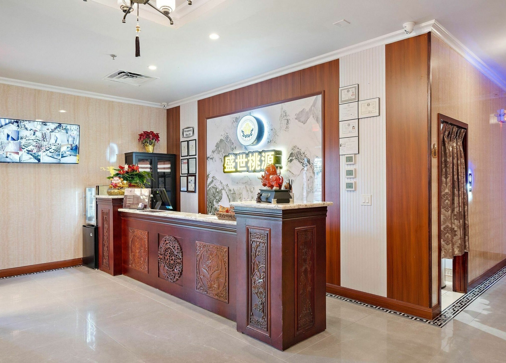 Inviting lobby at Prosperous Paradise Spa in Houston, Texas, featuring elegant decor and warm ambiance.