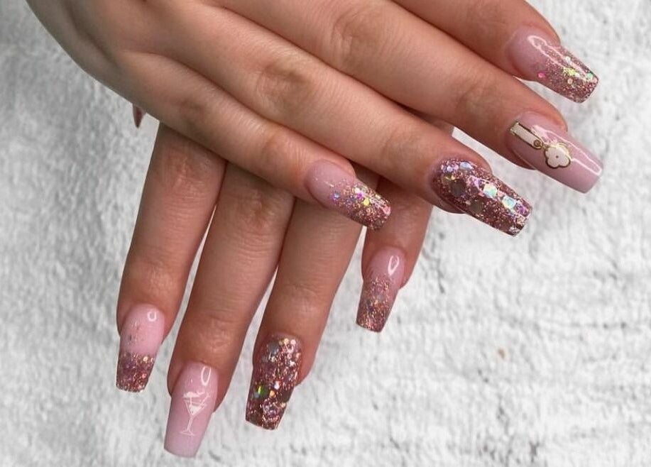 Elegant glittery nail art at Vivian Beauty Center, Dubai, Dubai, AE. Perfect blend of style and sophistication.