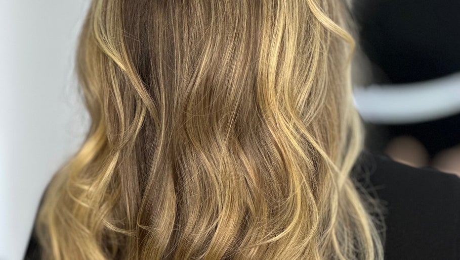 Stylish golden blonde hair with soft waves at Tom Colares Hair Dresser, Dublin, County Dublin, IE.