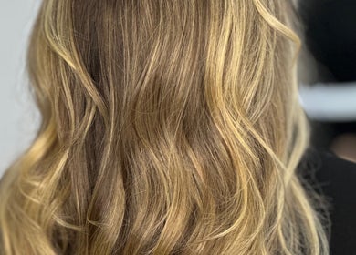 Stylish golden blonde hair with soft waves at Tom Colares Hair Dresser, Dublin, County Dublin, IE.
