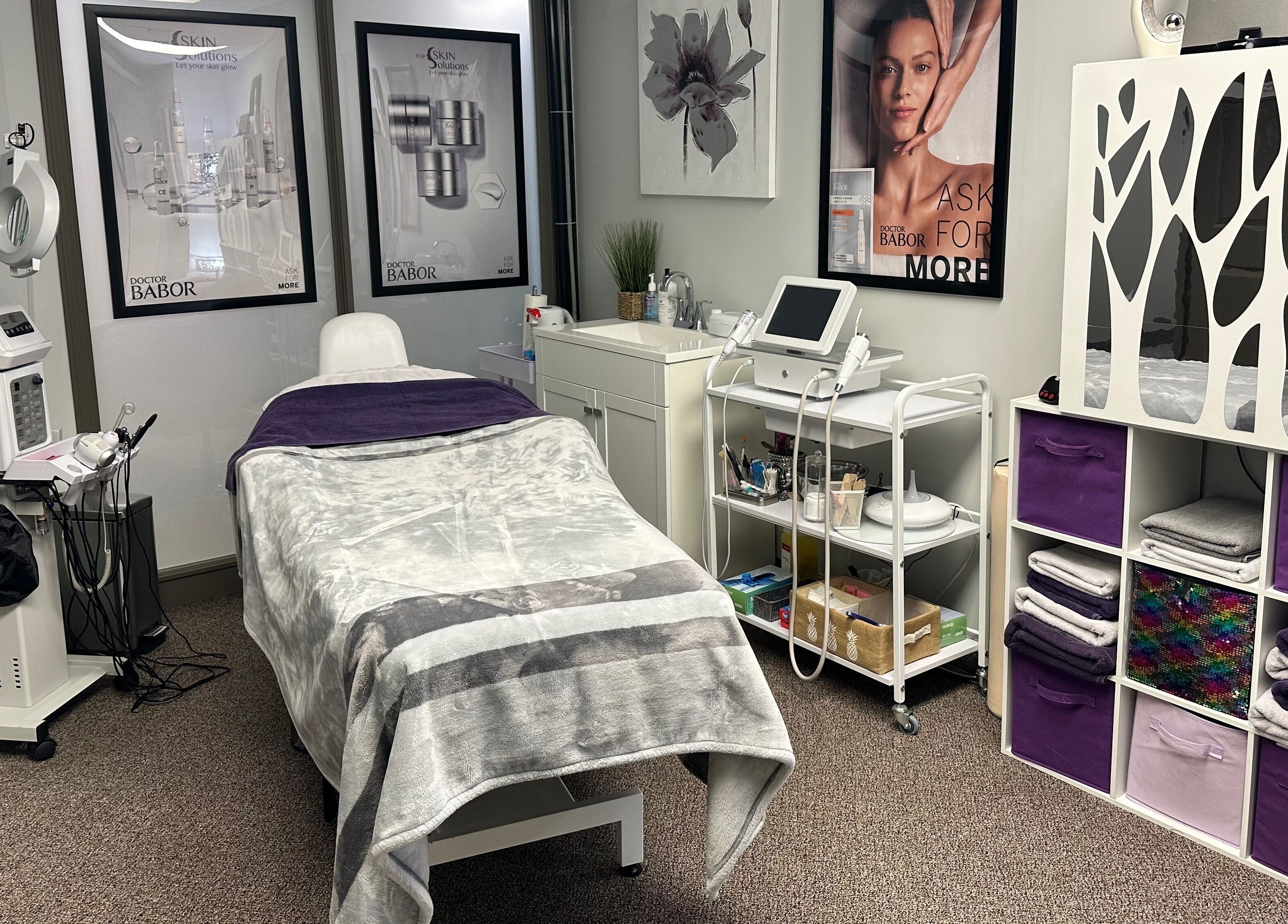 Cozy wellness treatment room at Top Skin Solutions, Sherwood Park, Alberta, CA, equipped with modern beauty devices.