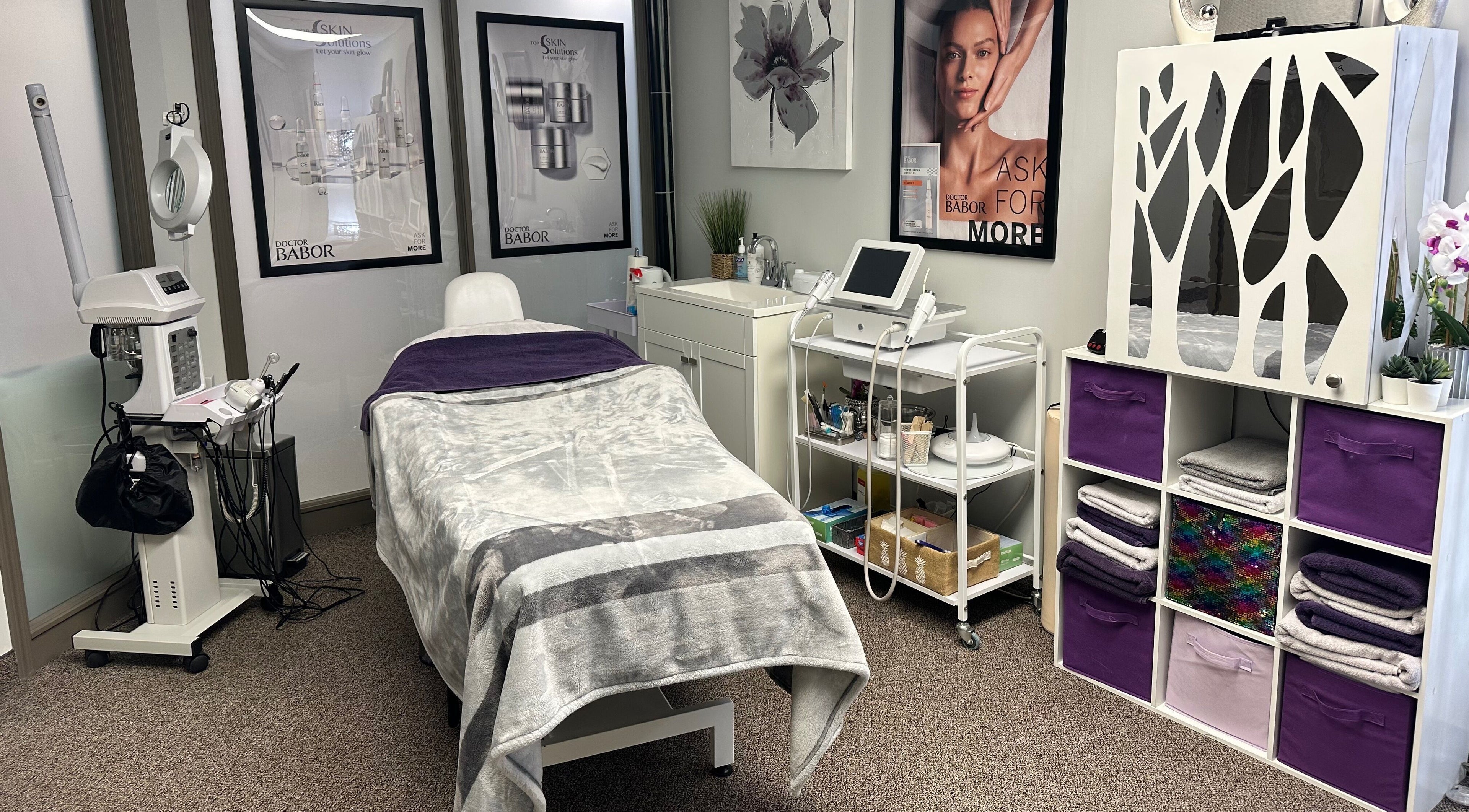 Cozy wellness treatment room at Top Skin Solutions, Sherwood Park, Alberta, CA, equipped with modern beauty devices.