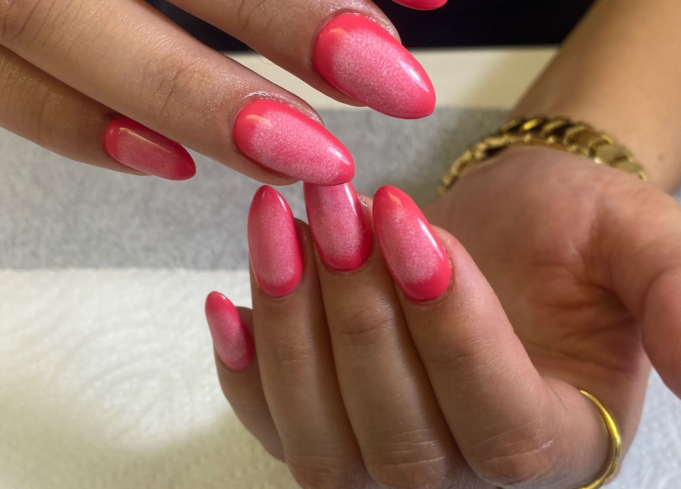 Vibrant pink nail art at Nail & Beauty Creations, Cape Town, Western Cape, ZA. Professional manicure service.