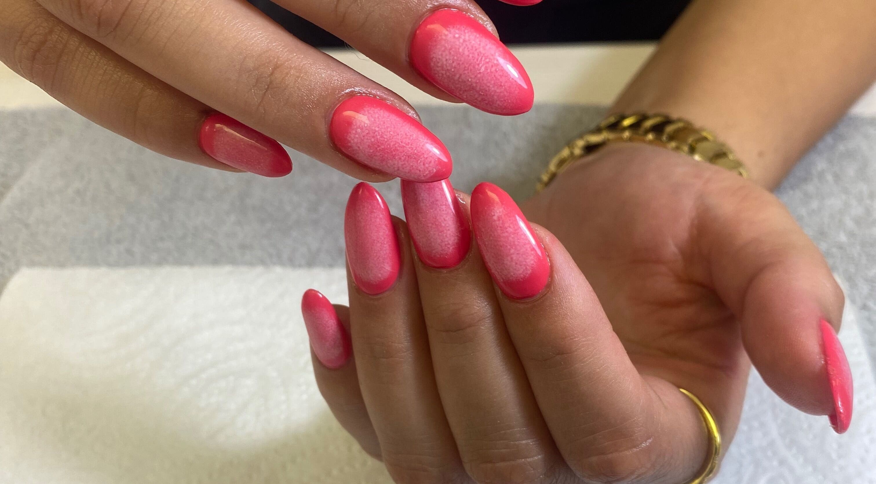 Vibrant pink nail art at Nail & Beauty Creations, Cape Town, Western Cape, ZA. Professional manicure service.