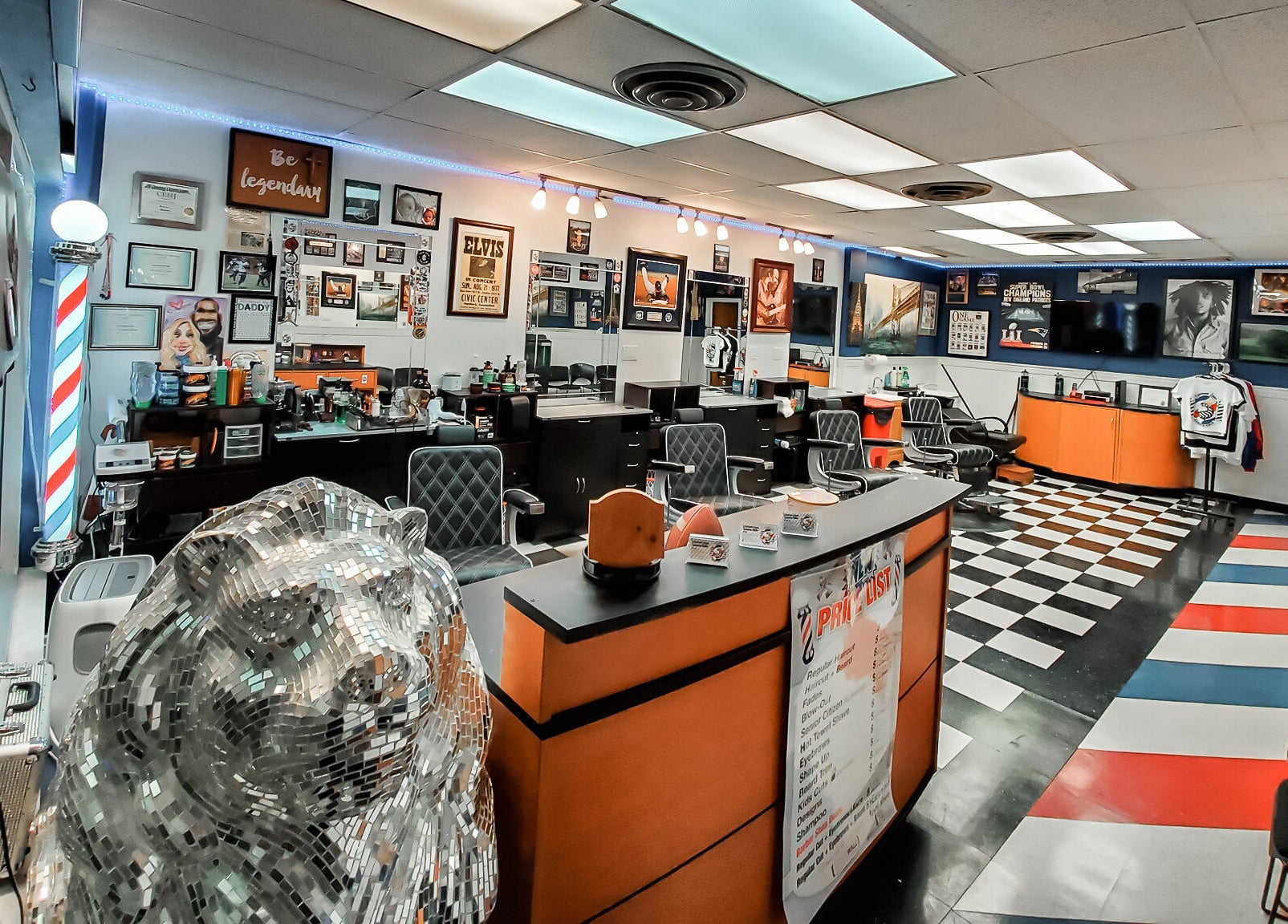 Interior view of Legendary Looks Barbershop in Vernon, Connecticut, showcasing stylish barber chairs and decor.