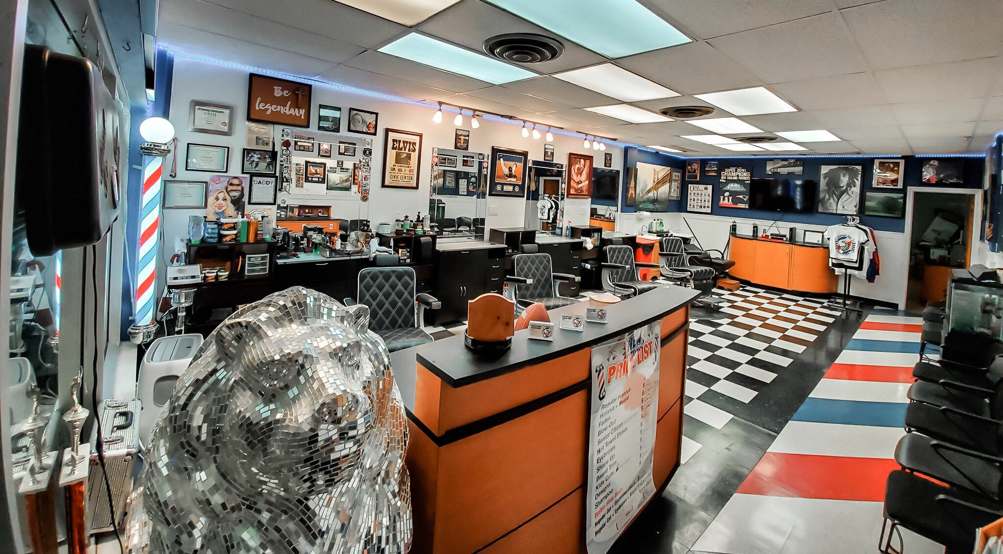 Interior view of Legendary Looks Barbershop in Vernon, Connecticut, showcasing stylish barber chairs and decor.
