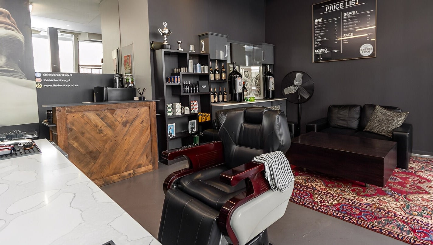 Stylish interior of The Barberchop in Cape Town featuring a modern barber chair and decor.