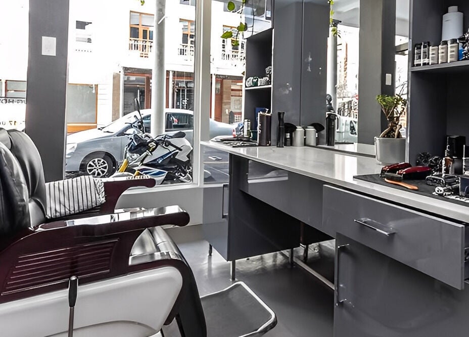 Elegant barber setup at The Barberchop, Cape Town, Western Cape, ZA. Modern chair and styling tools on display.
