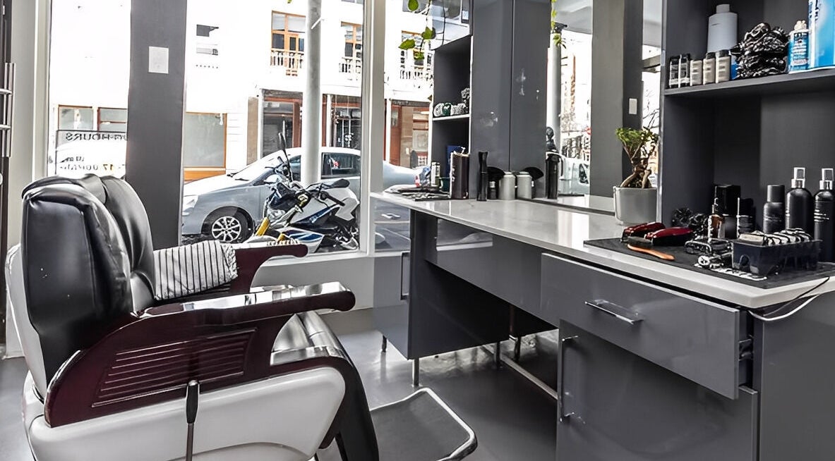 Elegant barber setup at The Barberchop, Cape Town, Western Cape, ZA. Modern chair and styling tools on display.
