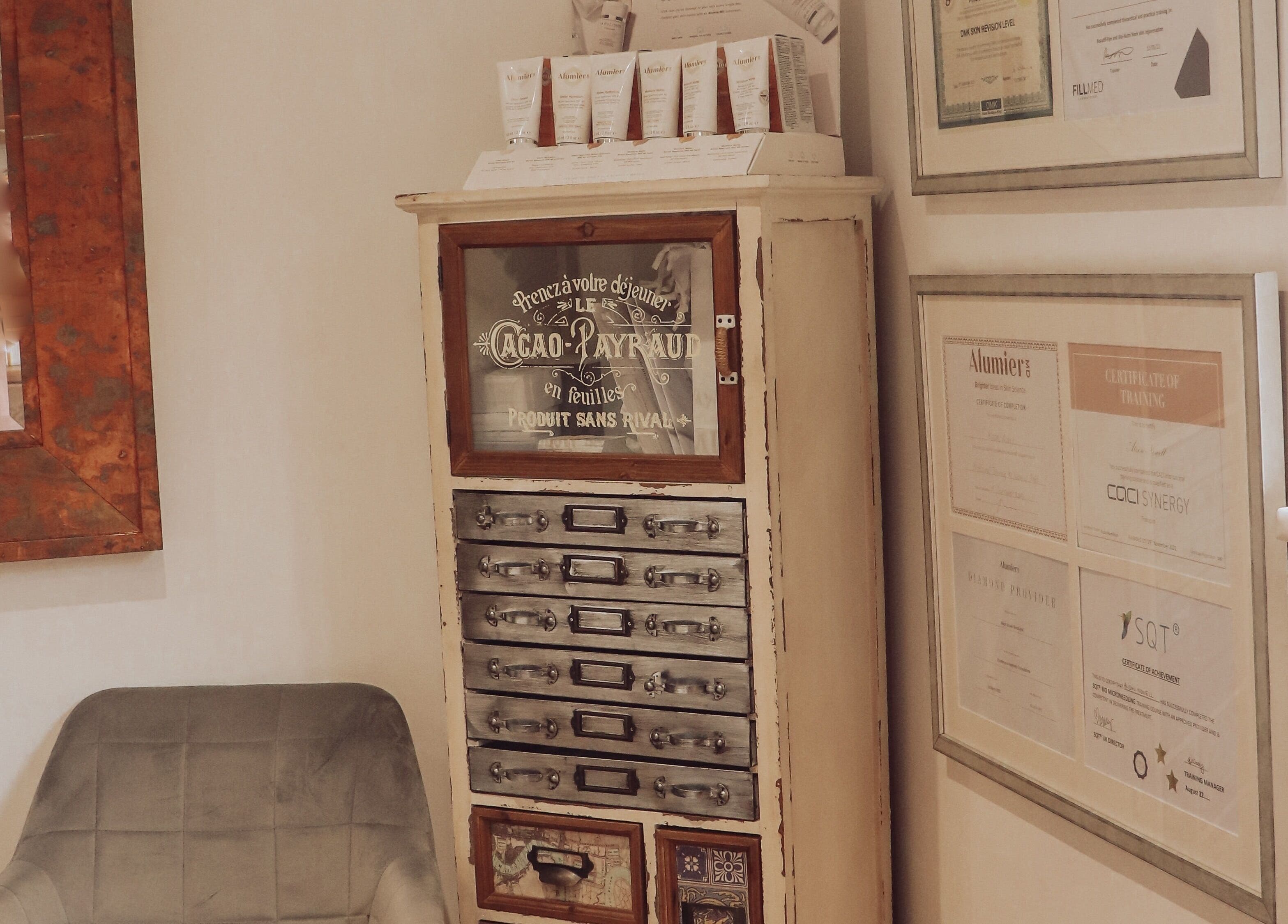 Rustic cabinet and certificates at Skinologist Advanced Treatments Ltd, Wrotham Heath, England, GB.