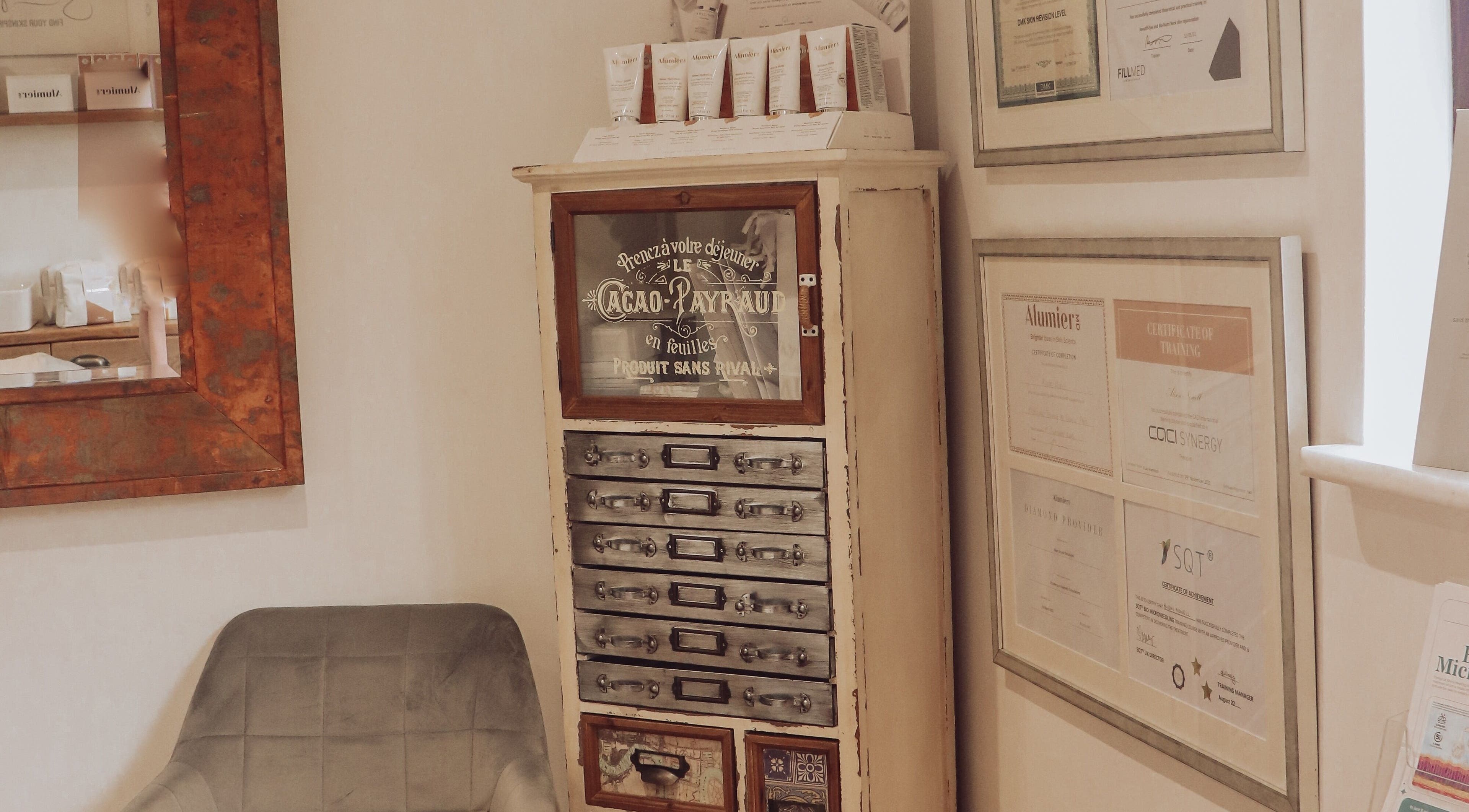 Rustic cabinet and certificates at Skinologist Advanced Treatments Ltd, Wrotham Heath, England, GB.