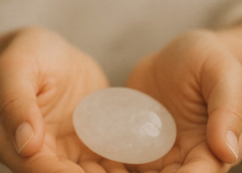A calming crystal held in hands at Healing With Dawn, Collingwood, Ontario, CA, promoting relaxation and peace.