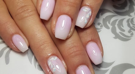 Beautiful ombre nails with glitter at Pretty Nails & Foot Clinic, Loughborough, England, GB.
