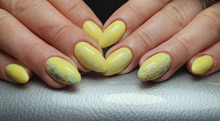 Yellow patterned nails at Pretty Nails & Foot Clinic, Loughborough, England, GB.