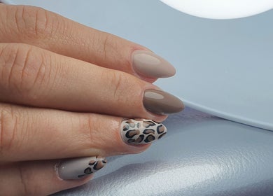 Stylish nail art in neutral tones at Pretty Nails & Foot Clinic, Loughborough, England, GB.