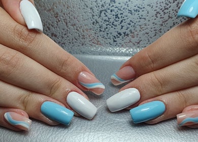 Stylish blue and white nails at Pretty Nails & Foot Clinic, Loughborough, England, GB.