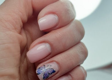 Elegant nail art with butterfly design at Pretty Nails & Foot Clinic, Loughborough, England, GB.