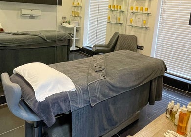 Relaxing treatment room at Vaughan's Hair and Beauty, Plymouth, England, GB, featuring cozy massage beds.