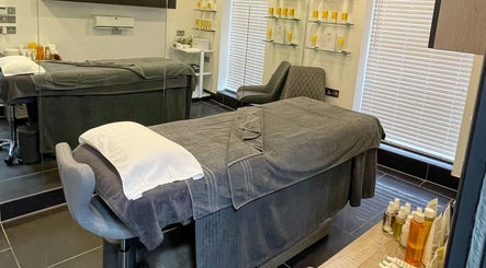 Relaxing treatment room at Vaughan's Hair and Beauty, Plymouth, England, GB, featuring cozy massage beds.