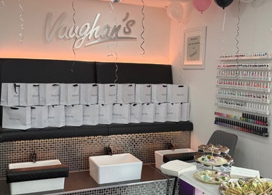 Vaughan's Hair and Beauty in Plymouth, England, GB with plush seating and beauty products on display.