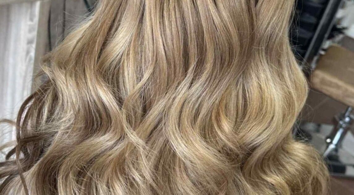 Flowing blonde waves styled at MB Hairdressing in Cheryl's Barbers, Barnsley, England. Perfect salon look.