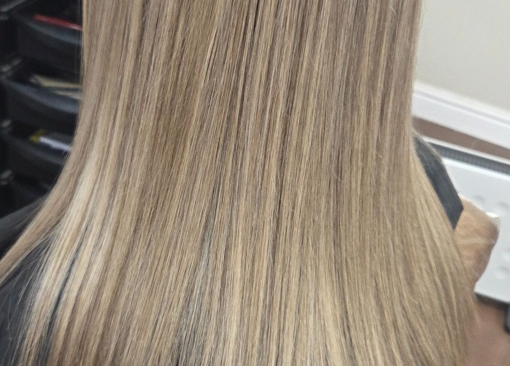 Sleek blonde hair styled at MB Hairdressing Based at Cheryl's Barbers, Barnsley, England, GB.