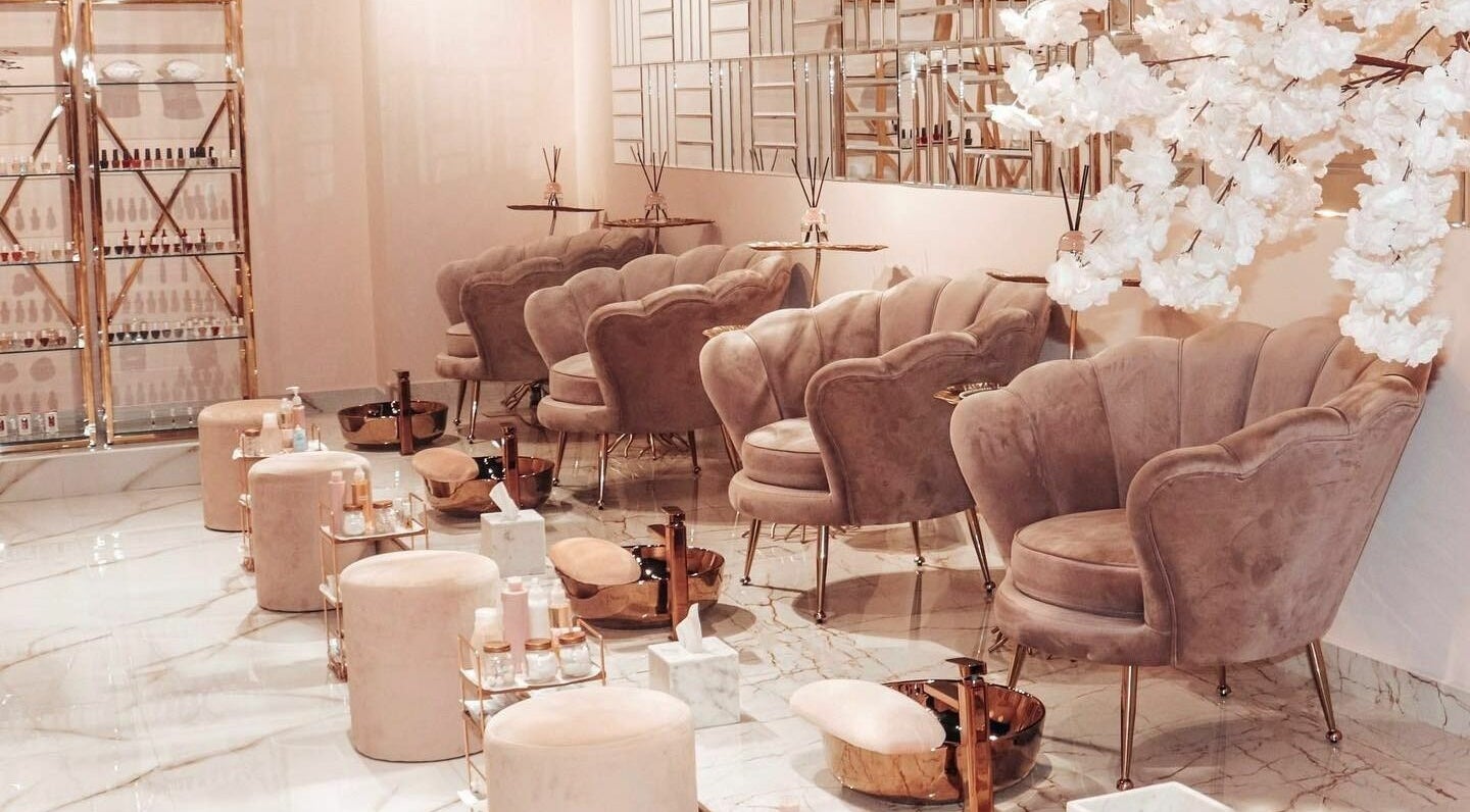 Elegant seating area at Yasna Beauty Salon, Dubai, AE, featuring plush chairs and chic decor.