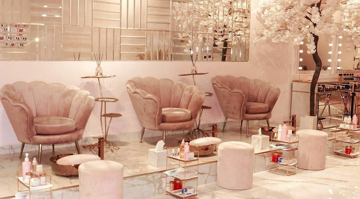 Luxurious interior of Yasna Beauty Salon in Dubai, AE with plush seating and ambient decor.