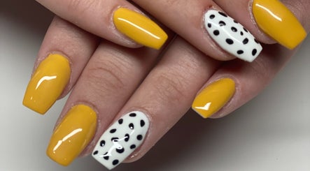 Stylish yellow and polka dot nails at The Beauty Lounge, Falmouth, England, GB.