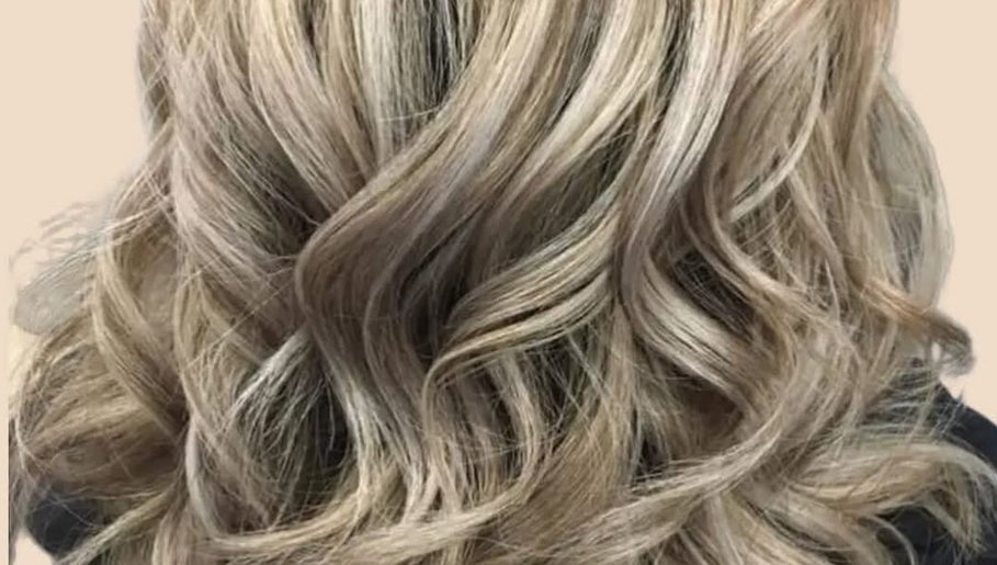 Elegant blonde curls styled at Clara Devlin Hair in Cardington, England, GB.
