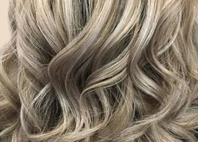 Elegant blonde curls styled at Clara Devlin Hair in Cardington, England, GB.