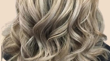 Elegant blonde curls styled at Clara Devlin Hair in Cardington, England, GB.