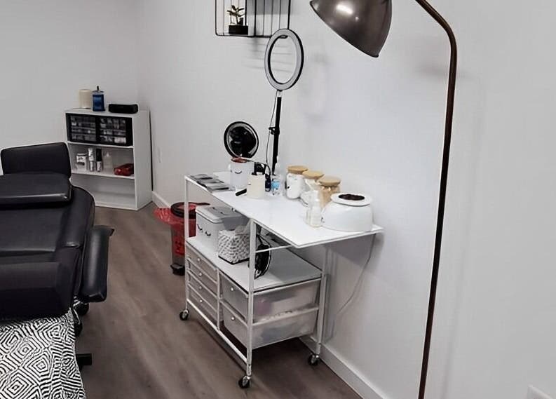 Cozy treatment room at Mav & Harp Co Salon, Selinsgrove, Pennsylvania, US, featuring a massage table and equipment.