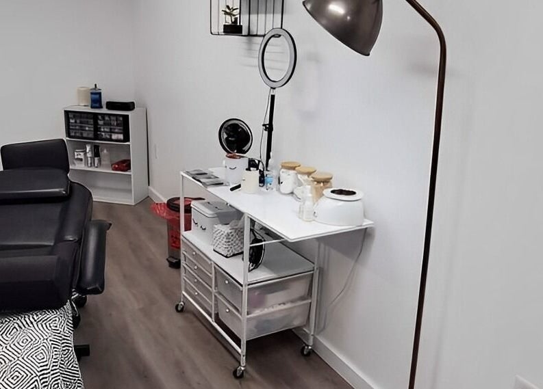 Cozy treatment room at Mav & Harp Co Salon, Selinsgrove, Pennsylvania, US, featuring a massage table and equipment.
